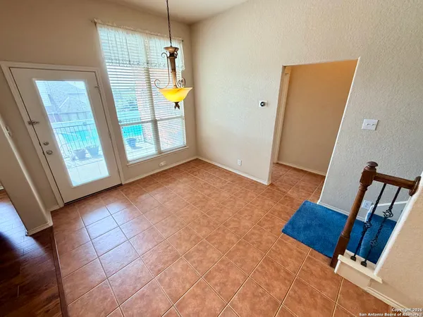 a view of an empty room with windows