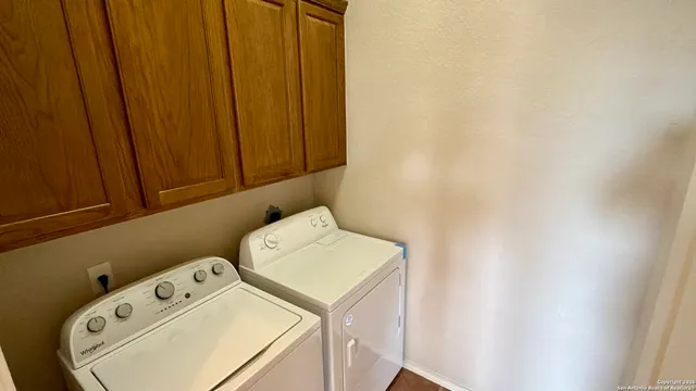 a utility room with dryer and washer