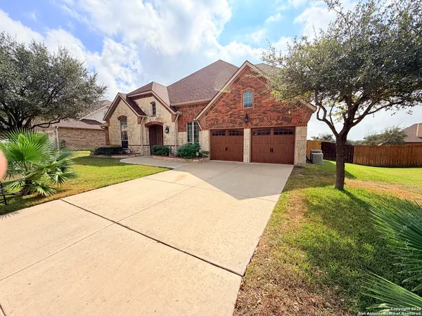 a house with huge green field in front of it
