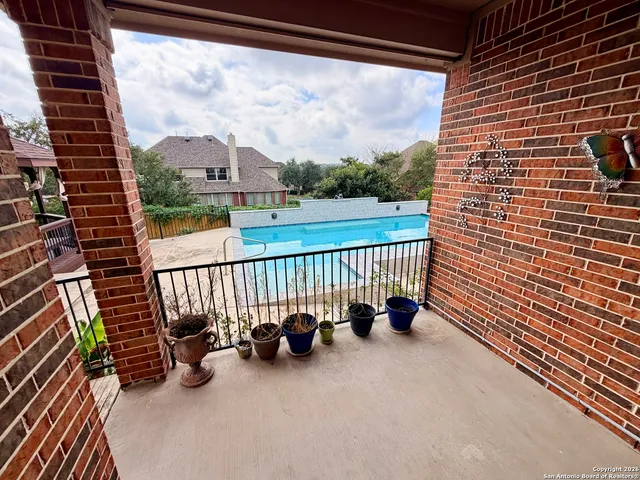 a view of a balcony with chairs