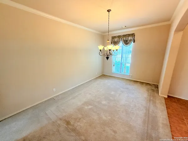 a view of a hallway with a chandelier