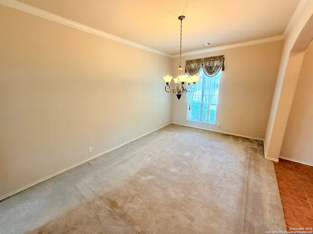 a view of a hallway with a chandelier