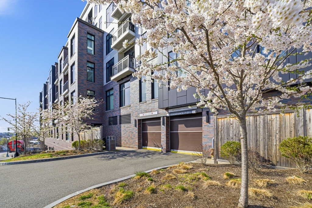 191 Washington Street, Unit 413 Boston, MA 02135 - Photo 3 of 40 a front view of a house with a garden