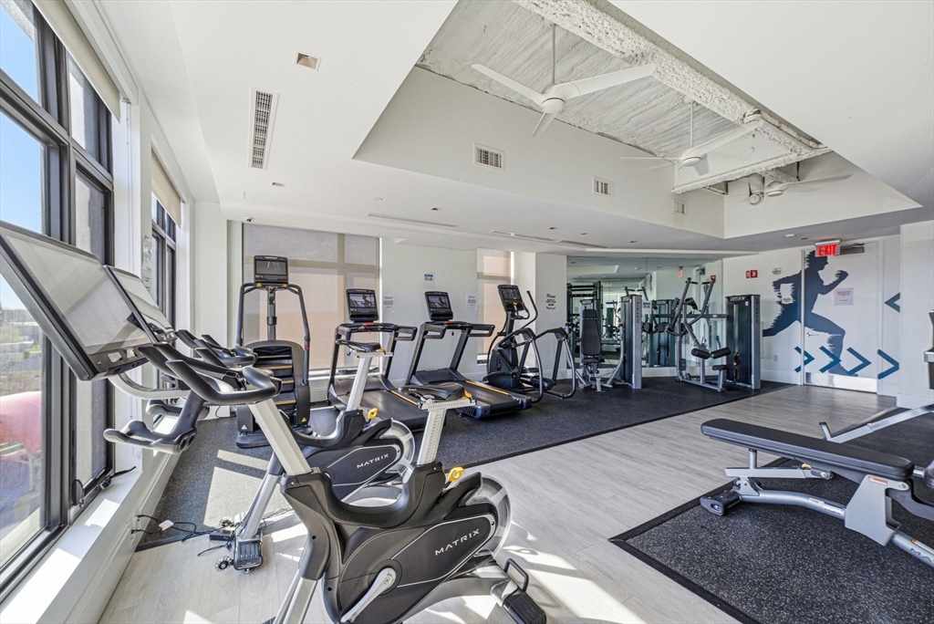 191 Washington Street, Unit 413 Boston, MA 02135 - Photo 36 of 40 a view of a room with gym equipment