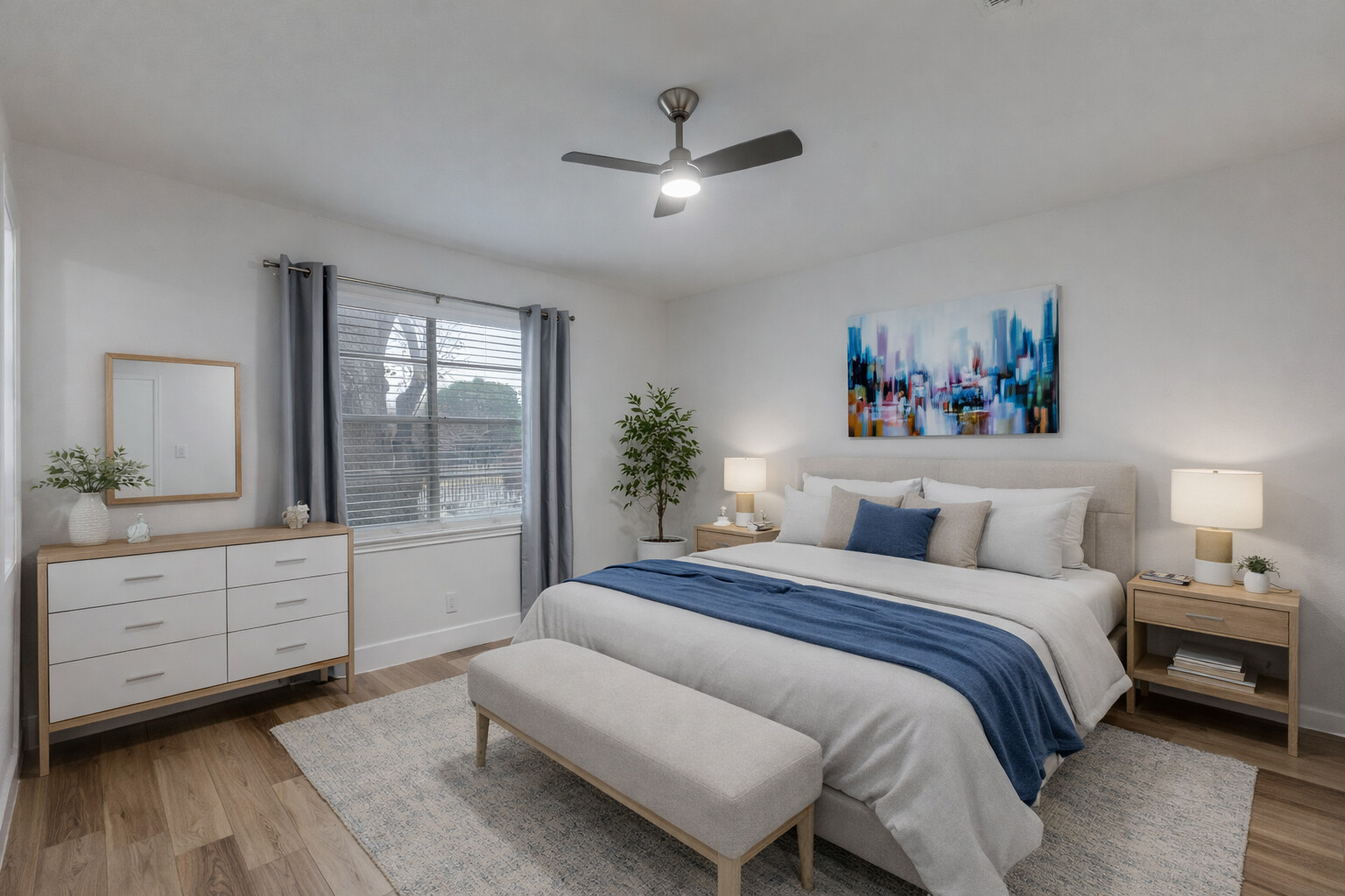 1845 River Crossing Circle, Unit A Austin, TX 78741 - Photo 2 of 31 Bedroom with light wood-style flooring and ceiling fan