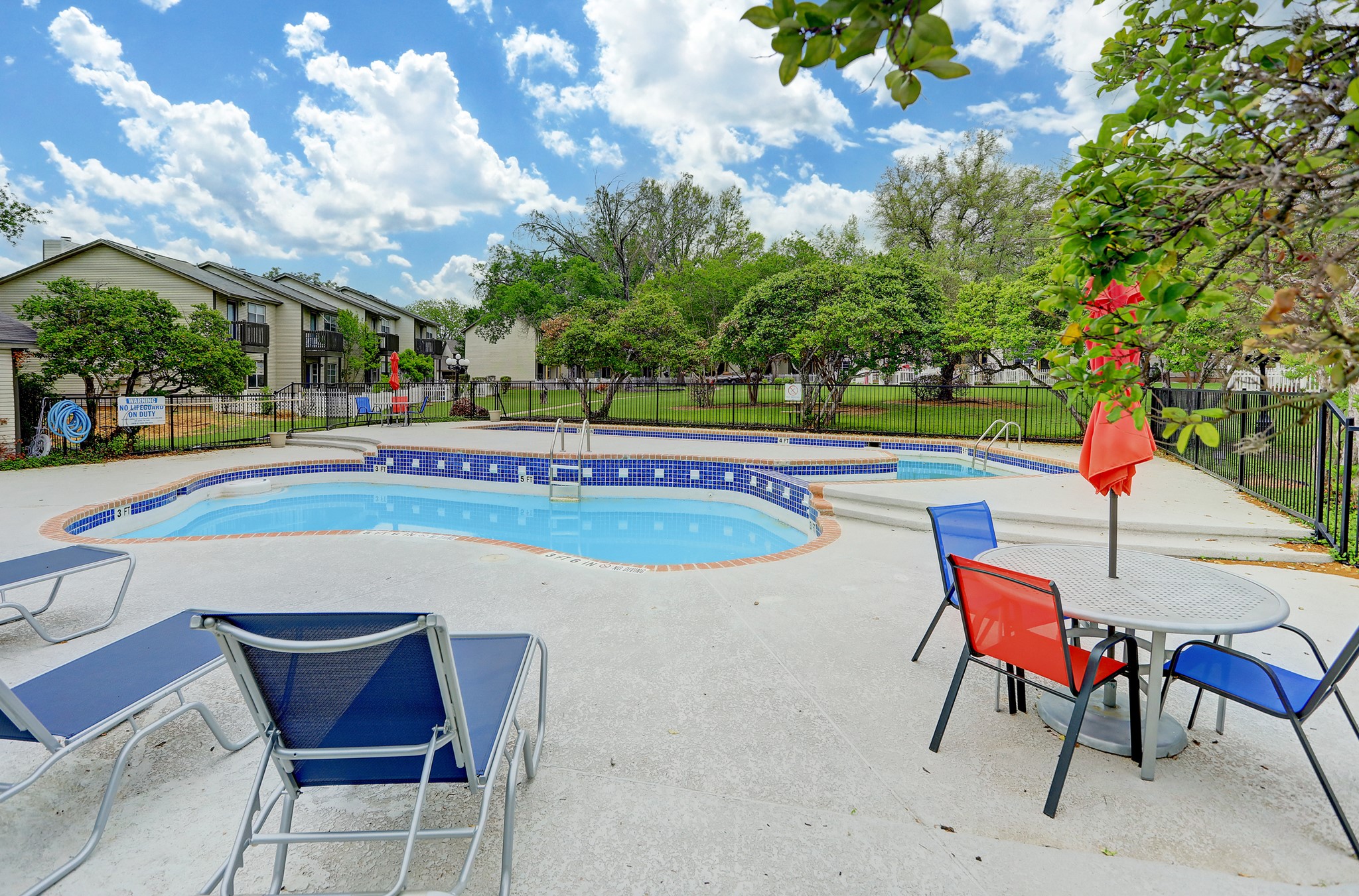 1845 River Crossing Circle, Unit A Austin, TX 78741 - Photo 25 of 31 View of pool with a patio and a pool with connected hot tub