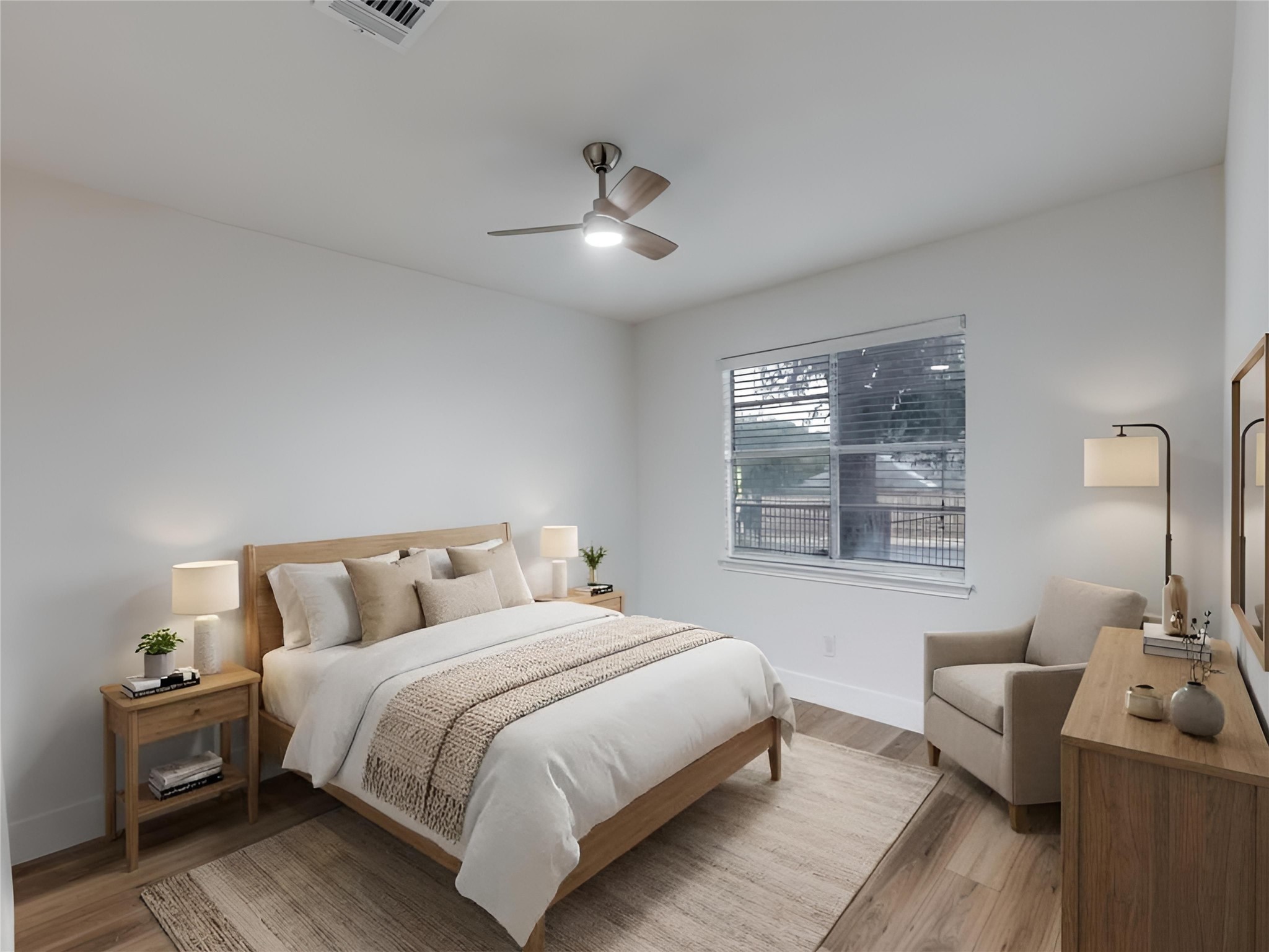 1845 River Crossing Circle, Unit A Austin, TX 78741 - Photo 4 of 31 Bedroom with light wood-style floors and ceiling fan