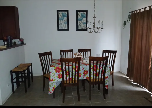 a view of a dining room with furniture