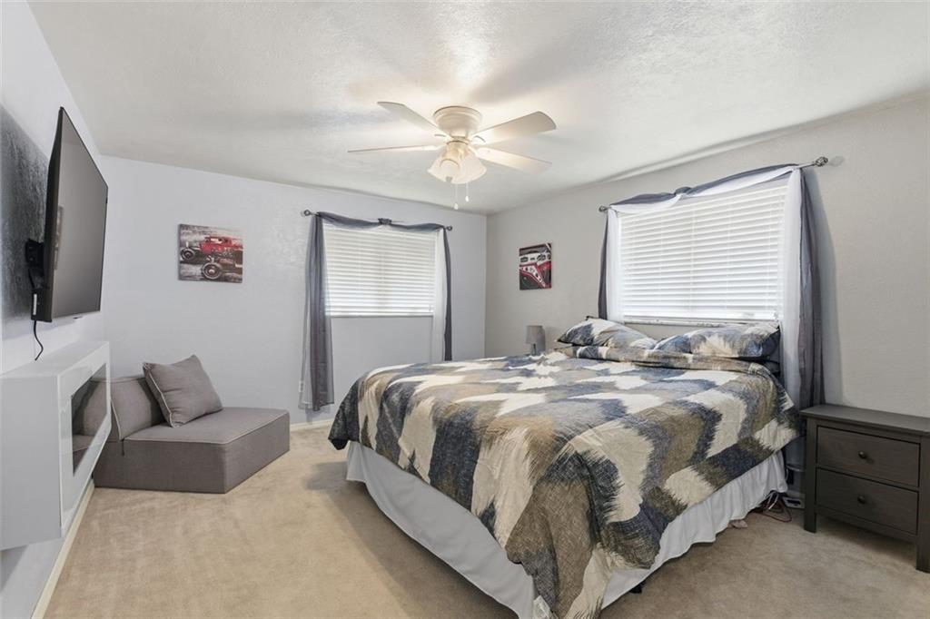 120 Crestview Manor Monongahela, PA 15063 - Photo 18 of 38 a bedroom with a bed and a flat screen tv