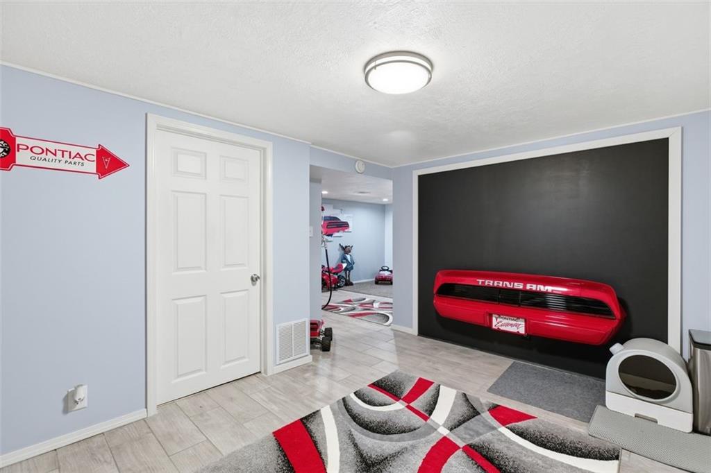 120 Crestview Manor Monongahela, PA 15063 - Photo 27 of 38 a living room with furniture and a flat screen tv