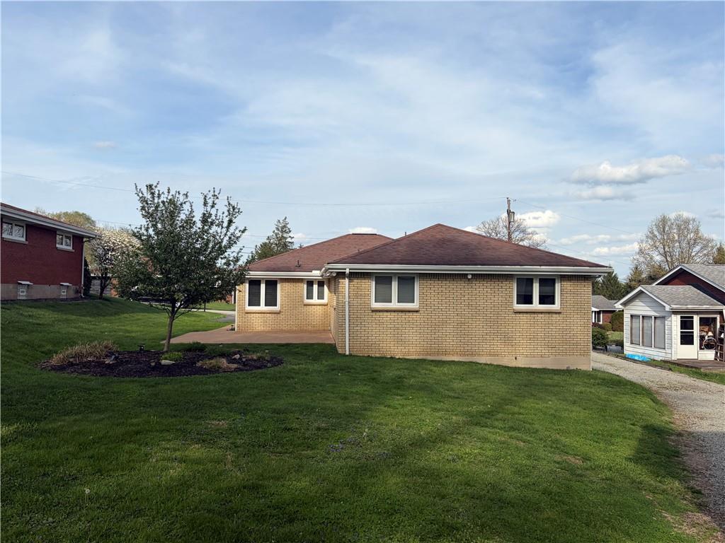 120 Crestview Manor Monongahela, PA 15063 - Photo 3 of 38 a front view of a house with a garden
