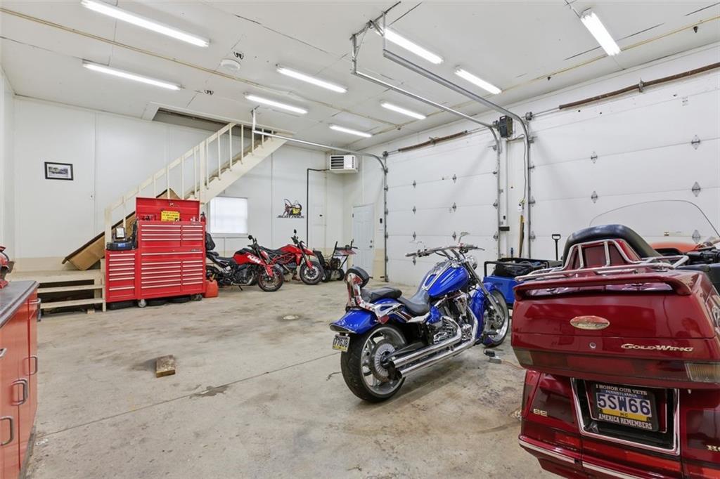120 Crestview Manor Monongahela, PA 15063 - Photo 34 of 38 a view of a garage with a bike and wooden roof