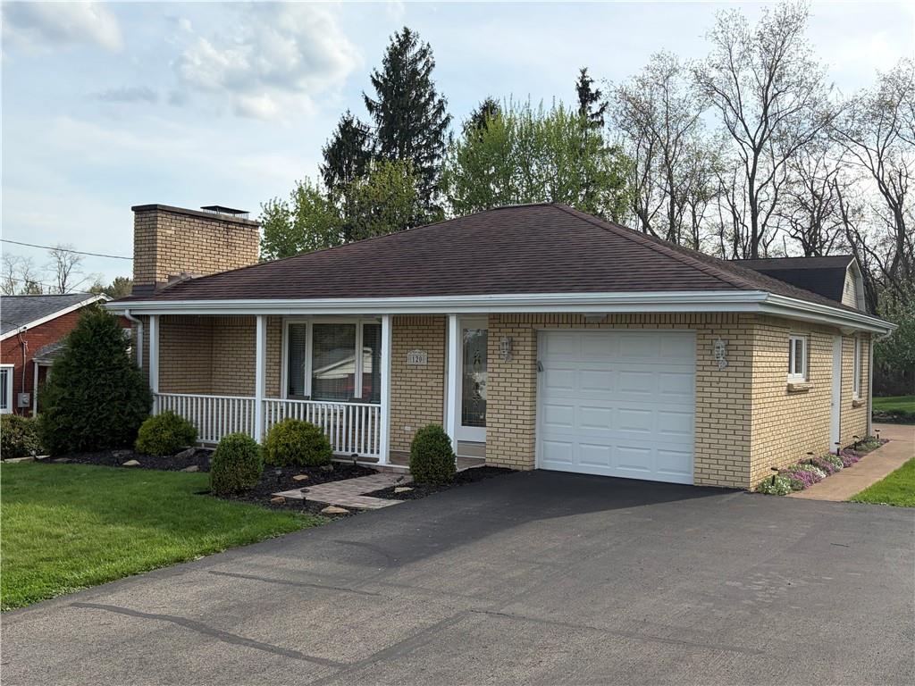 120 Crestview Manor Monongahela, PA 15063 - Photo 38 of 38 a front view of a house with a yard and garage