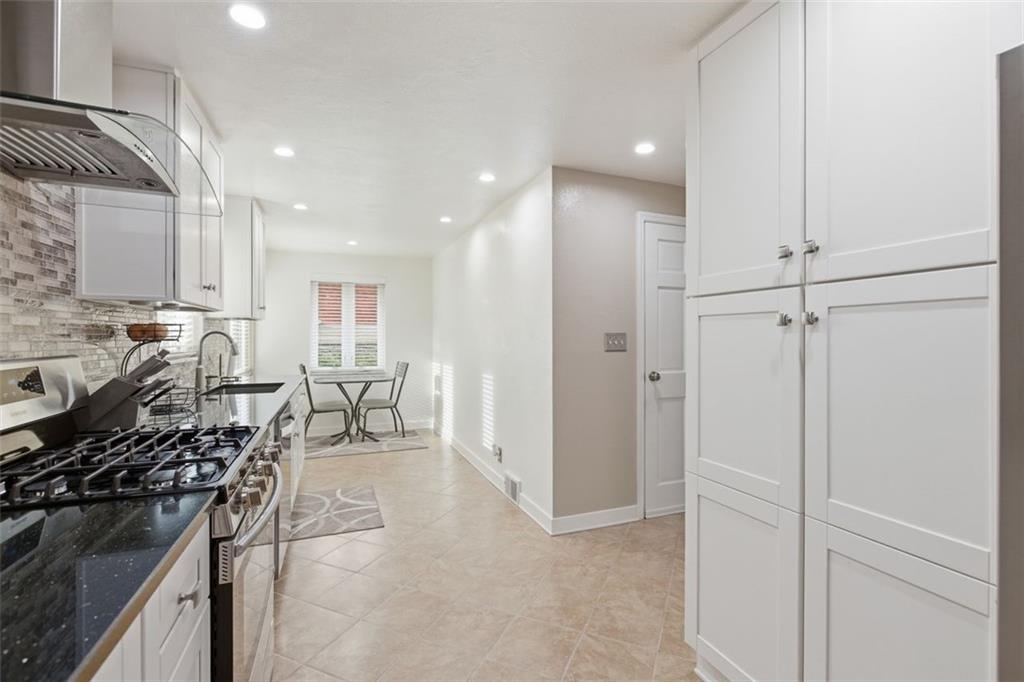 120 Crestview Manor Monongahela, PA 15063 - Photo 7 of 38 a kitchen with stainless steel appliances granite countertop a stove and a refrigerator