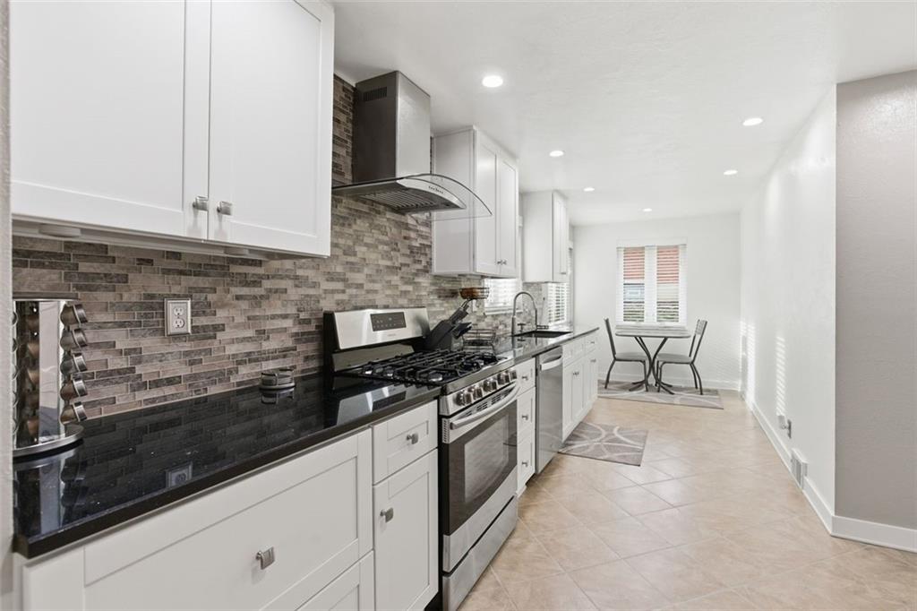 120 Crestview Manor Monongahela, PA 15063 - Photo 8 of 38 a kitchen with stainless steel appliances granite countertop a stove a sink and a microwave