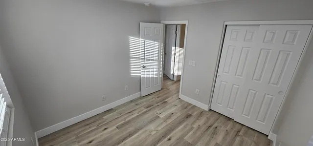 a view of backyard with swimming pool and seating space