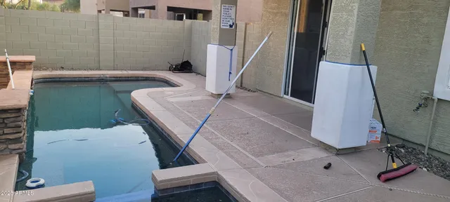 a view of a hallway with wooden floor and stairs