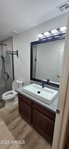 a view of a patio with couches and potted plants