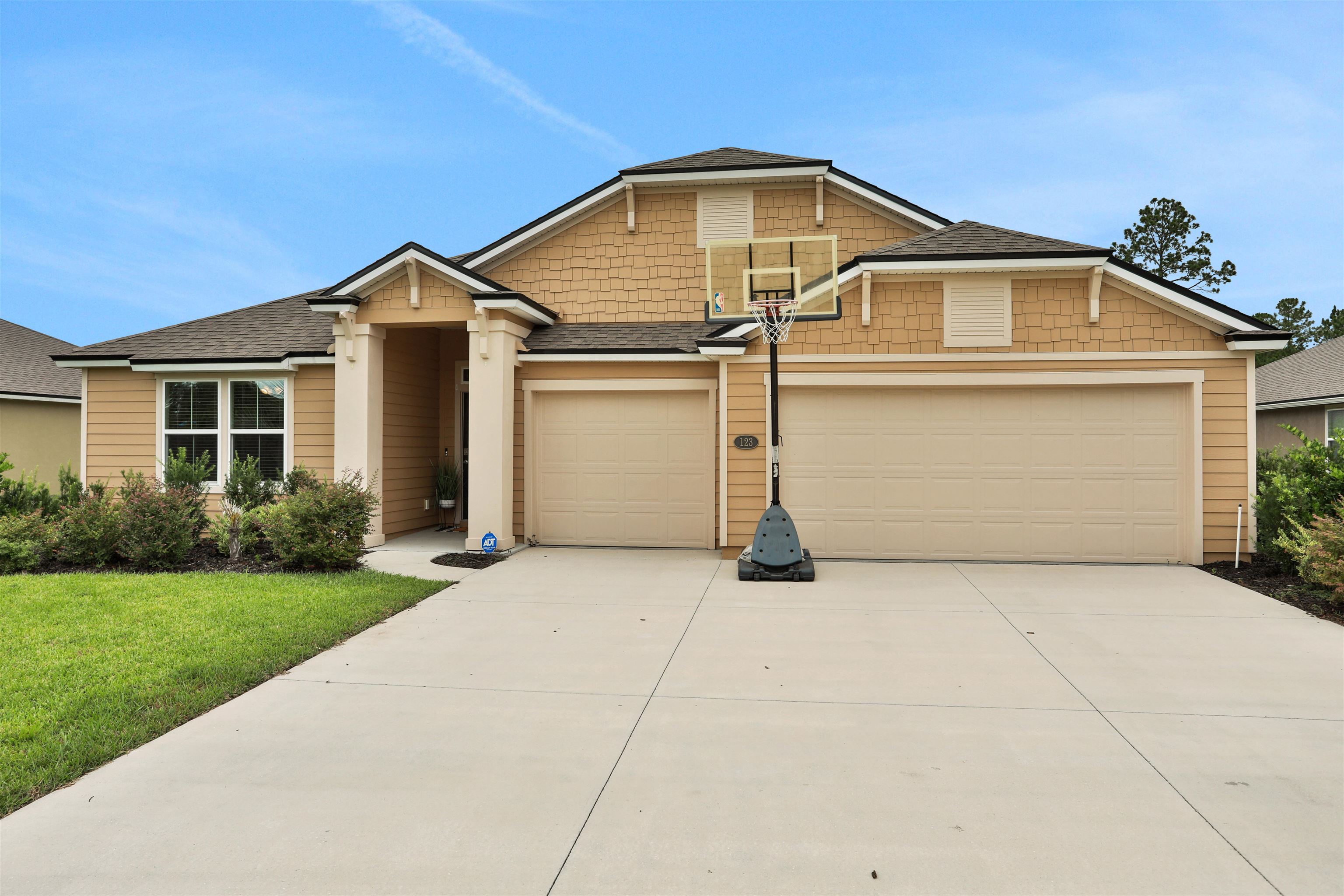 123 Hickory Ridge Road St. Augustine, FL 32084 - Photo 29 of 29 a front view of a house with a yard