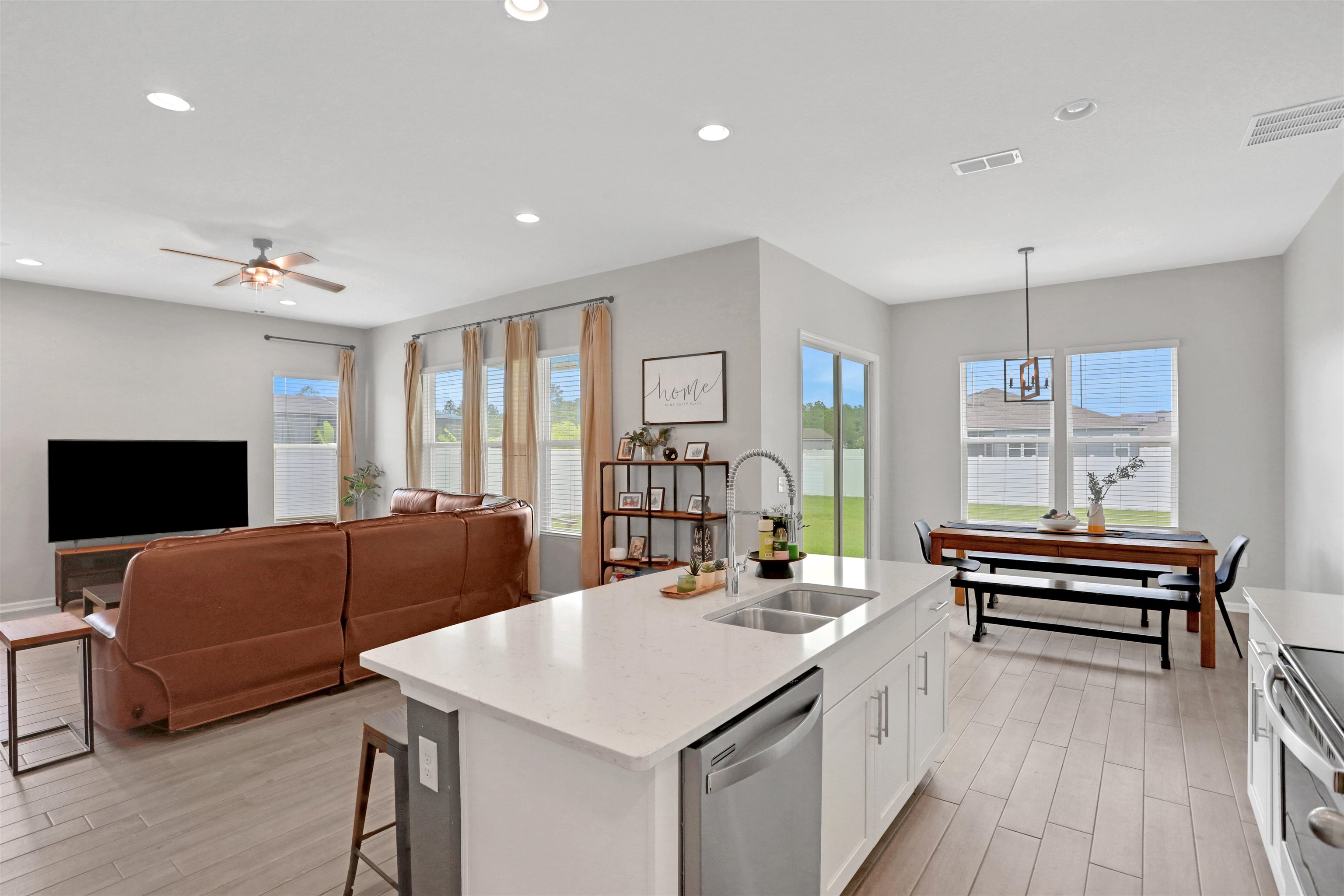 123 Hickory Ridge Road St. Augustine, FL 32084 - Photo 3 of 29 a living room with a couch and a flat screen tv