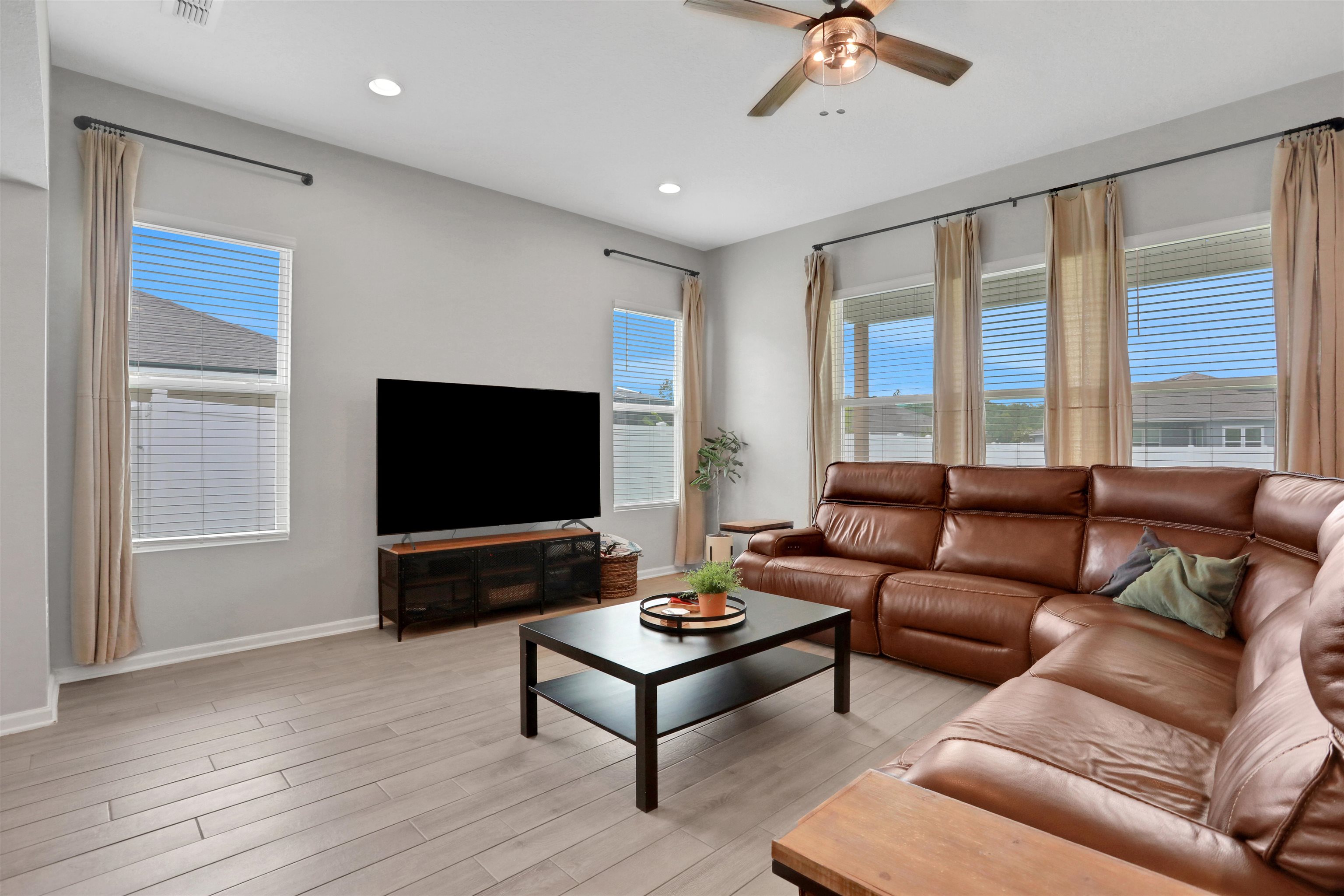 123 Hickory Ridge Road St. Augustine, FL 32084 - Photo 7 of 29 a living room with furniture and a flat screen tv