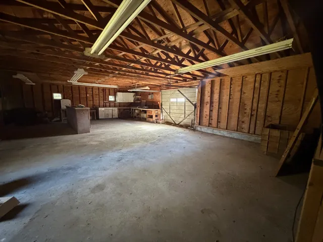 a view of an empty room with a car parked