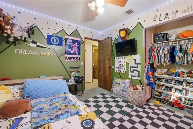 a bedroom with furniture and a window