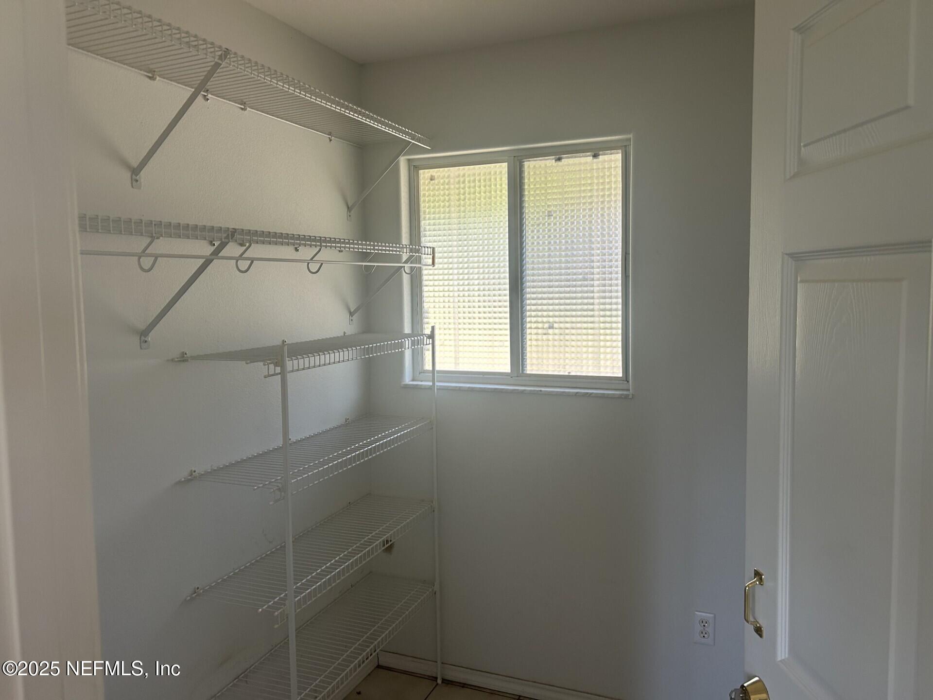 121 Walton Road East Palatka, FL 32131 - Photo 15 of 48 a view of a room with racks on the wall