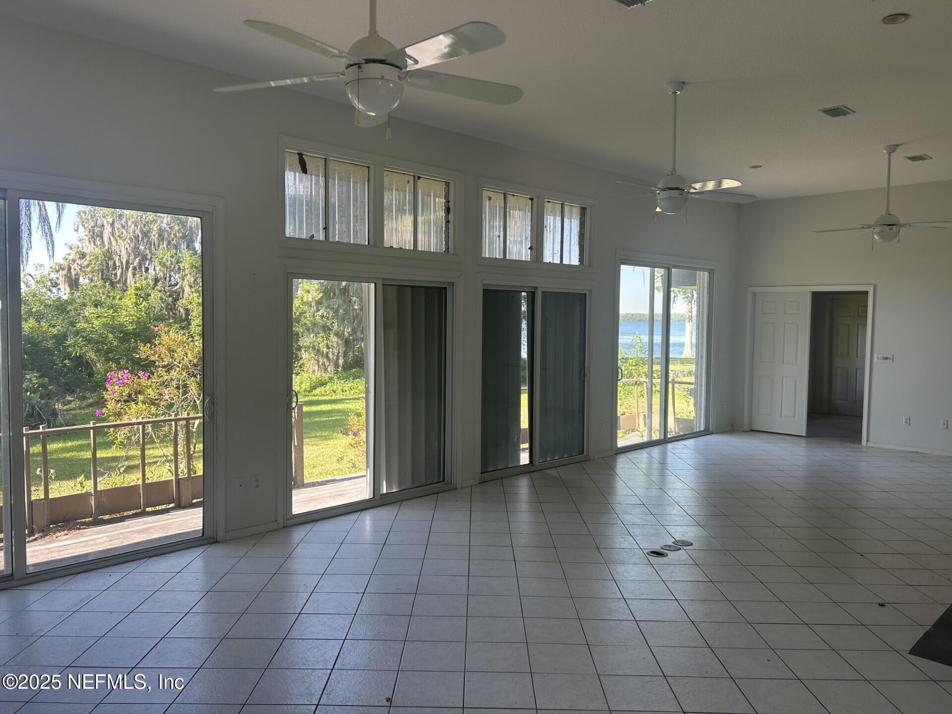 121 Walton Road East Palatka, FL 32131 - Photo 18 of 48 a view of an empty room with window and cabinet