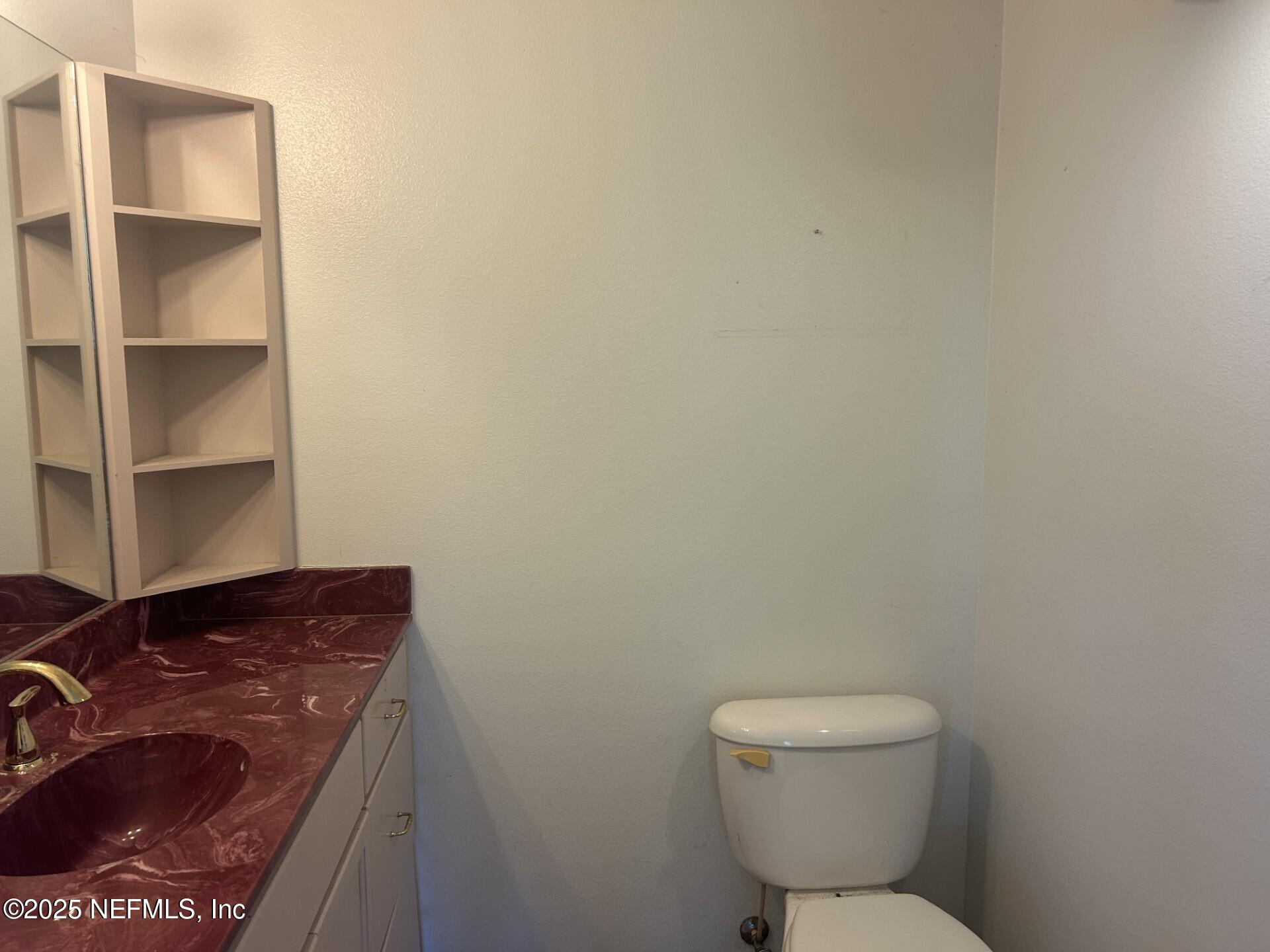 121 Walton Road East Palatka, FL 32131 - Photo 28 of 48 a bathroom with a toilet and a sink