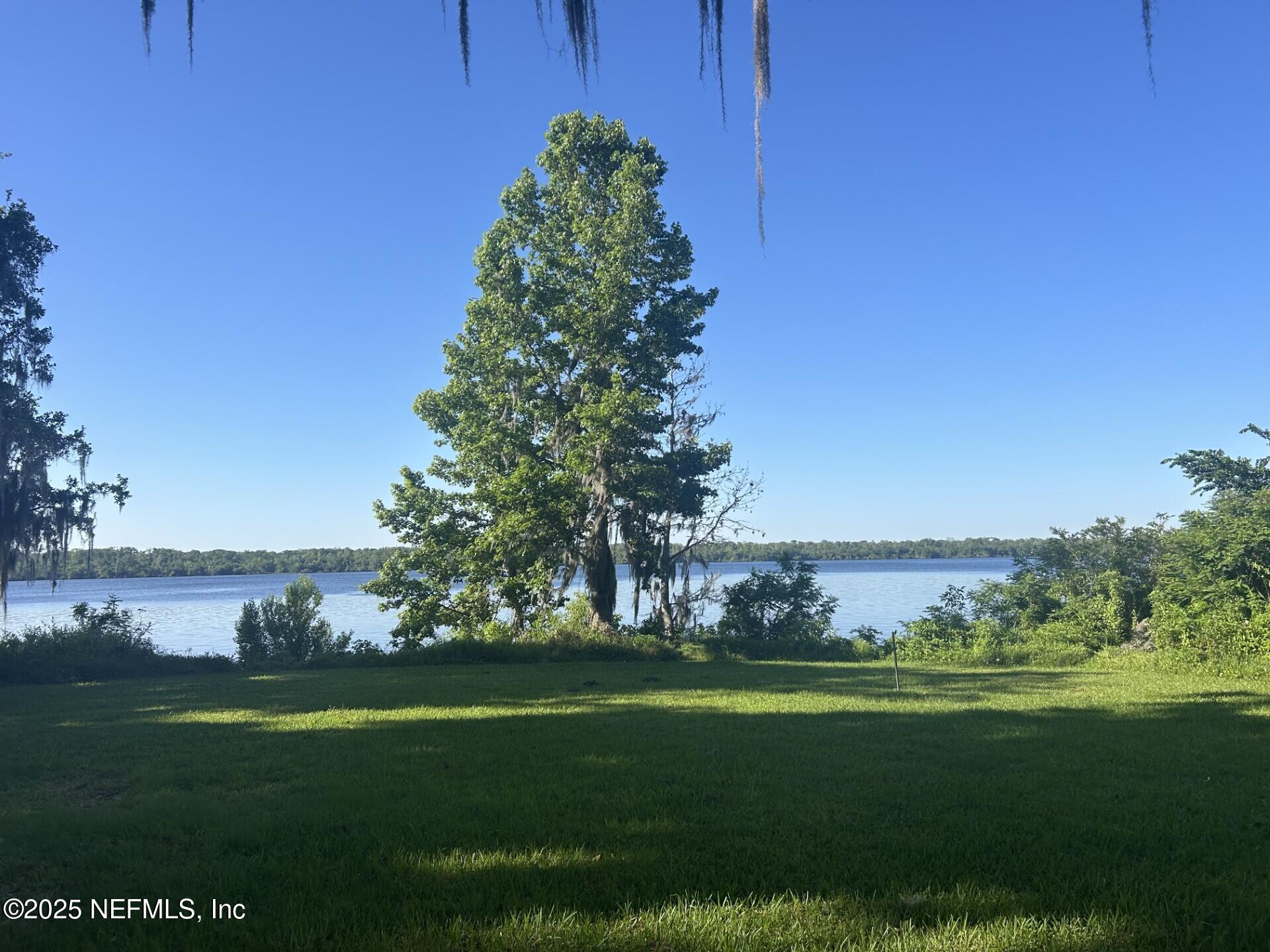 121 Walton Road East Palatka, FL 32131 - Photo 46 of 48 a view of a golf course with a lake
