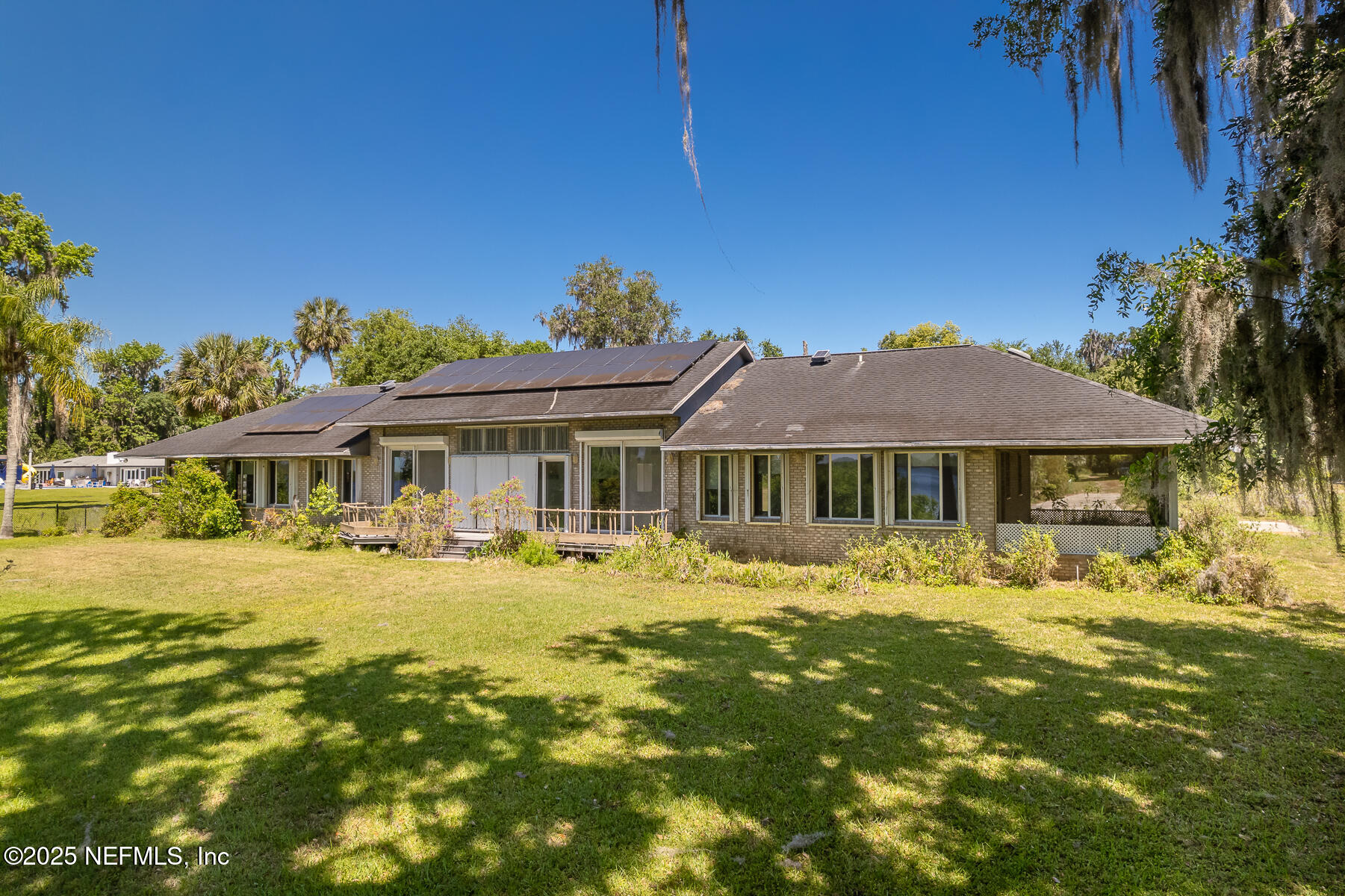 121 Walton Road East Palatka, FL 32131 - Photo 9 of 48 a front view of a house with a garden