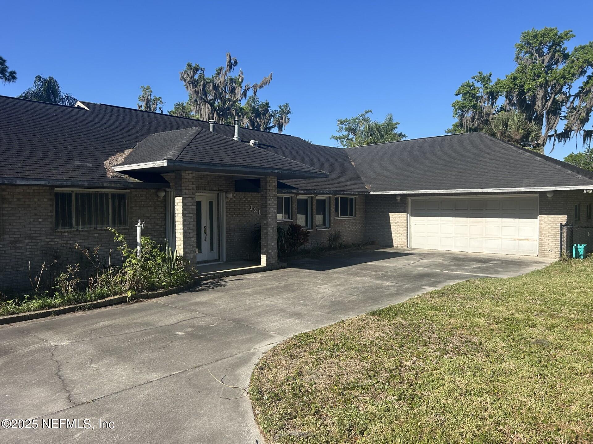 121 Walton Road East Palatka, FL 32131 - Photo 10 of 48 a front view of a house with a yard