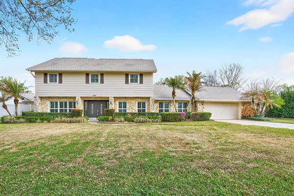 front view of a house with a yard