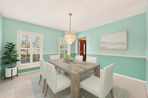 a living room with furniture a ceiling fan and a rug