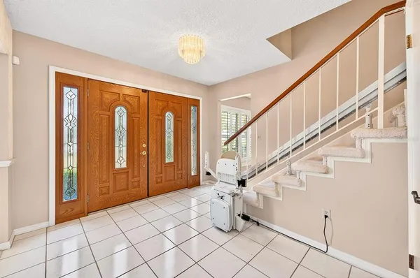 a spacious bedroom with a bed and a flat screen tv