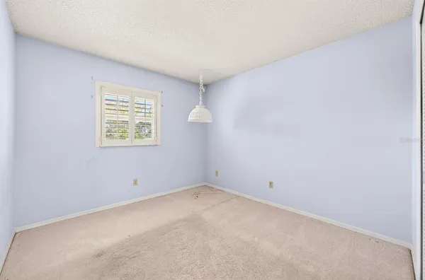 a view of washer and dryer with kitchen in the background