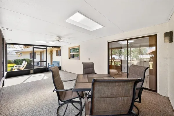 a view of a patio with a table and chairs