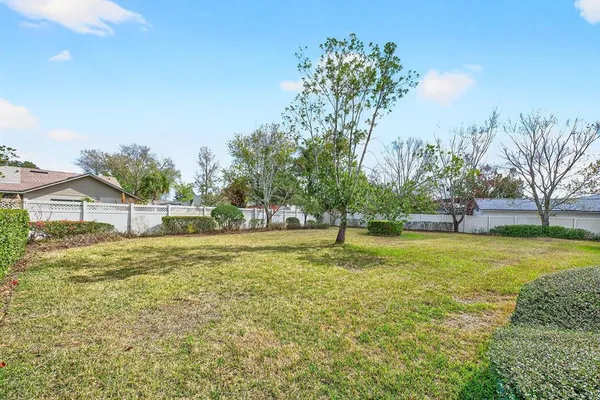 aerial view of a house with a backyard
