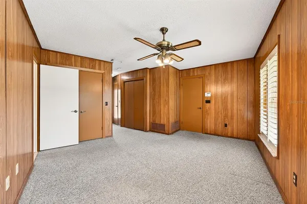 a view of an empty room with a flat screen tv