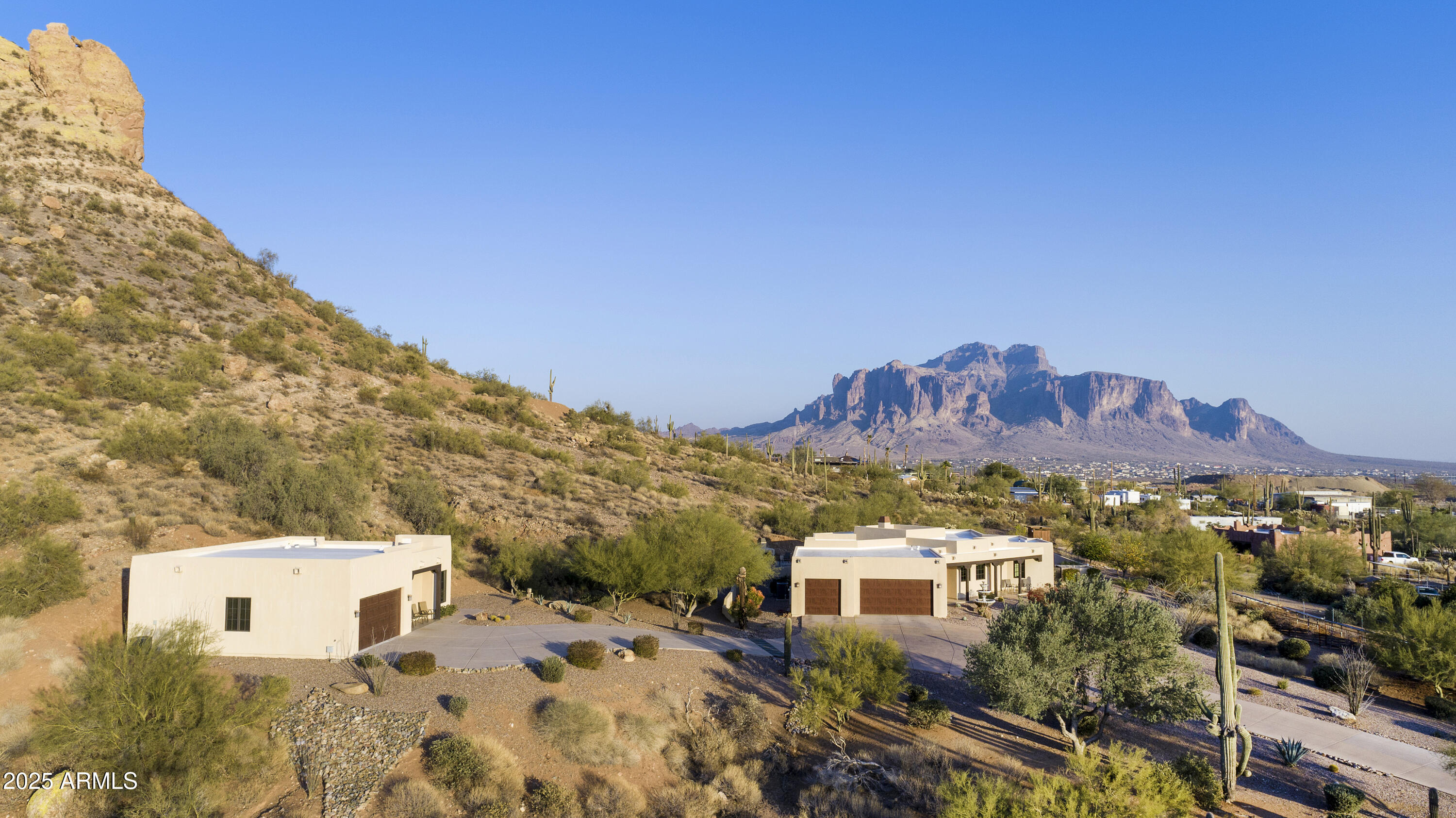 5117 North Cortez Road Apache Junction, AZ 85119 - Photo 1 of 61 a view of a house with a yard and wooden fence