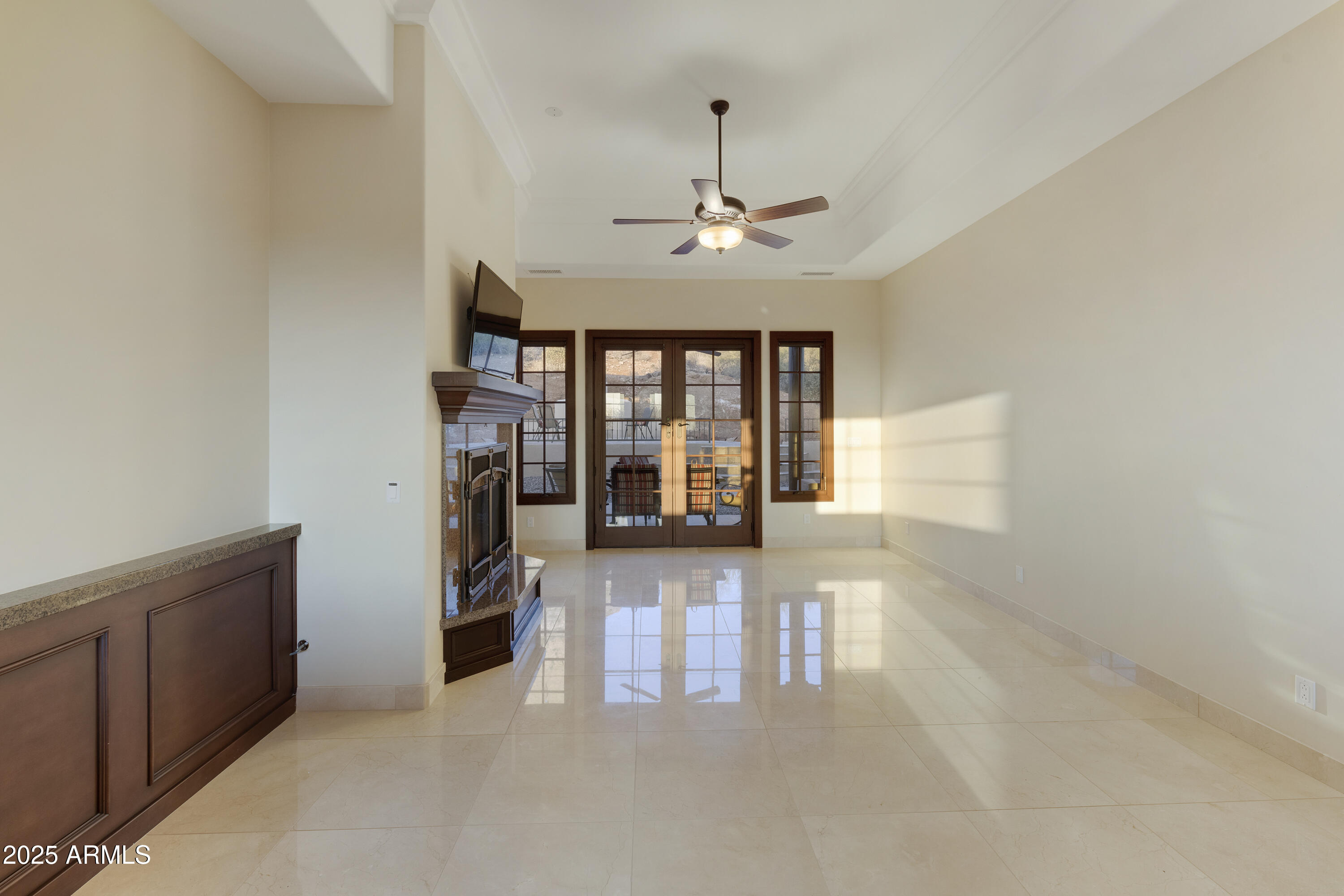 5117 North Cortez Road Apache Junction, AZ 85119 - Photo 10 of 61 a view of a livingroom with furniture chandelier fan and windows