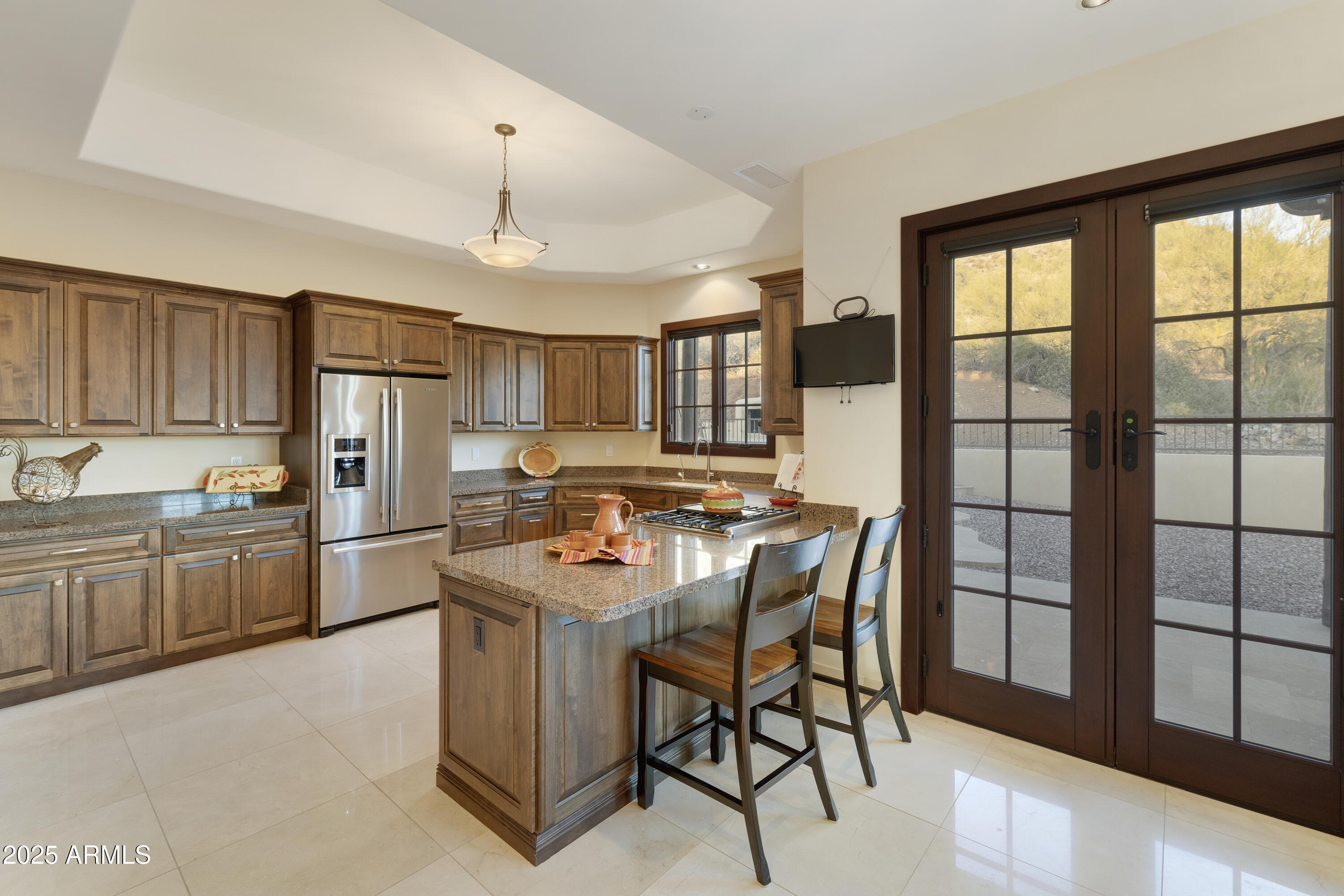 5117 North Cortez Road Apache Junction, AZ 85119 - Photo 12 of 61 a kitchen that has a lot of cabinets in it and wooden floors