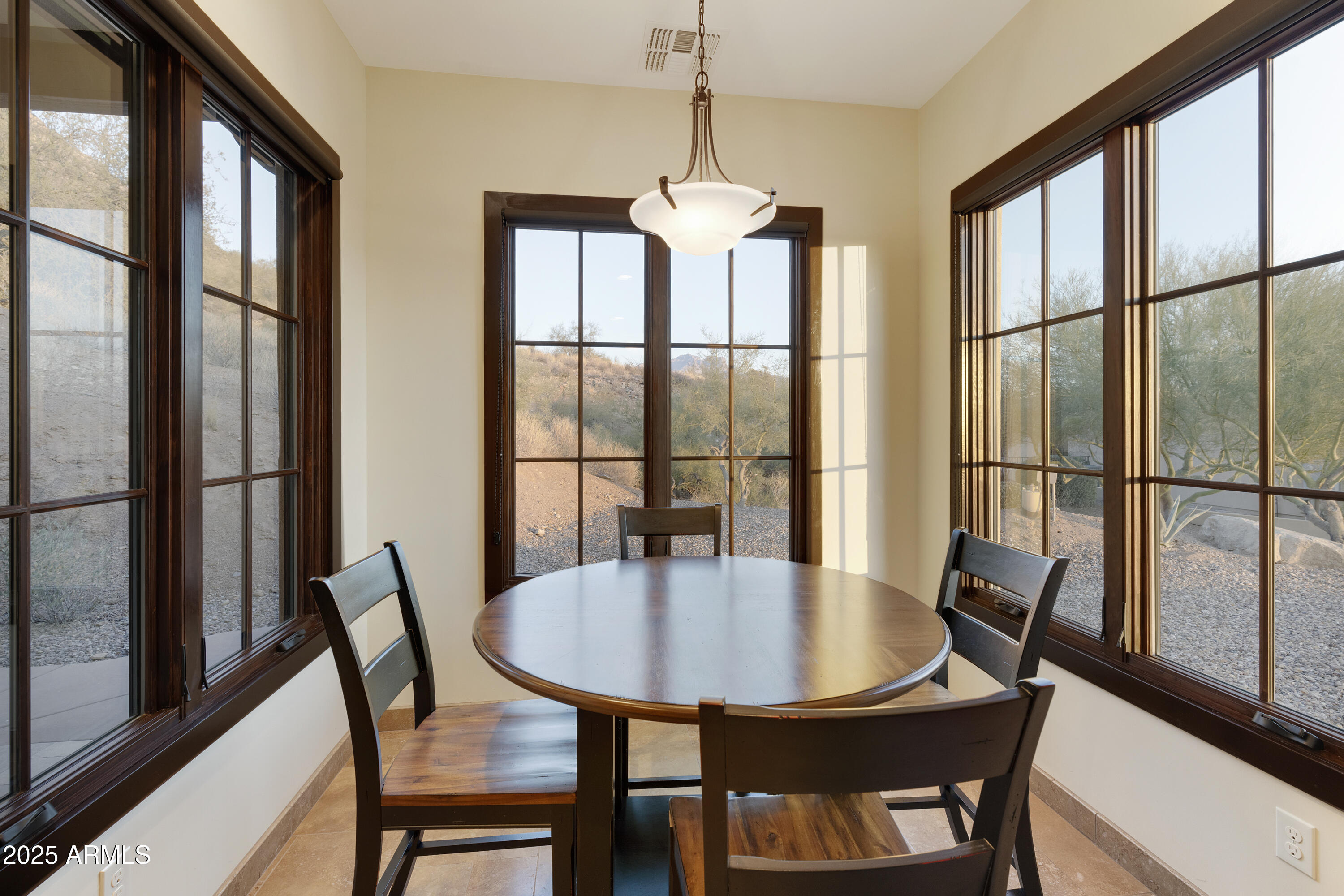 5117 North Cortez Road Apache Junction, AZ 85119 - Photo 41 of 61 a dining room with furniture a chandelier and wooden floor