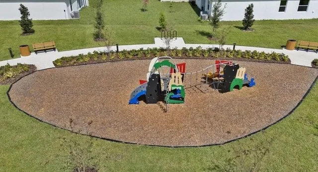 an aerial view of a house with outdoor space