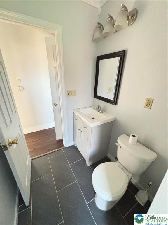 213 Penn Street Bath, PA 18014 - Photo 11 of 22 a bathroom with a toilet a sink and mirror