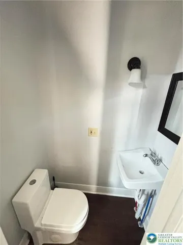 a bathroom with a toilet and a sink