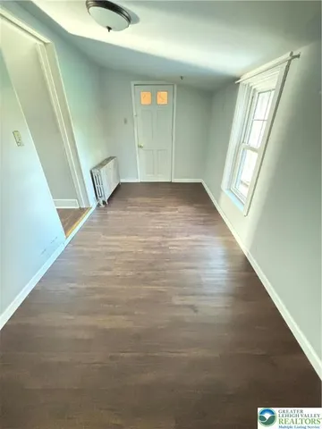 a view of an empty room and window