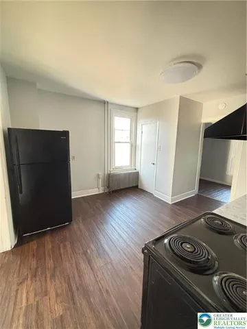 a view of a livingroom with wooden floor