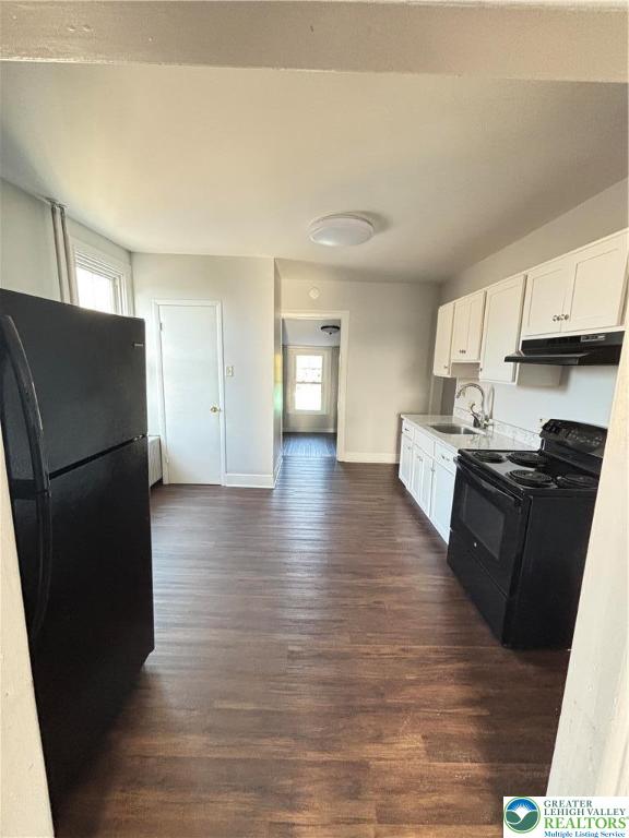 213 Penn Street Bath, PA 18014 - Photo 6 of 22 a kitchen with stainless steel appliances granite countertop a refrigerator a stove and a wooden floors